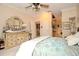Bedroom featuring an antique dresser with mirror, large carpeted floor, and view of the bathroom at 1970 Michael Tiago Cir, Maitland, FL 32751