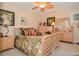 Bedroom features a nature-themed decor, natural wood furniture, and a ceiling fan at 1970 Michael Tiago Cir, Maitland, FL 32751