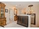 Bright hallway with decorative accents, detailed millwork, and neutral carpet, enhancing the home's sophisticated design at 1970 Michael Tiago Cir, Maitland, FL 32751