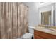 Standard bathroom features a toilet, sink, shower and tub combination with a fabric curtain at 2061 Crestdale Ln # 60, Lake Mary, FL 32746