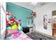 Comfortable bedroom with stuffed animals, decorated with colorful lighting and decor at 2061 Crestdale Ln # 60, Lake Mary, FL 32746