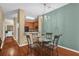 Dining room boasts hardwood floors, a modern chandelier, and views of the kitchen area at 2061 Crestdale Ln # 60, Lake Mary, FL 32746