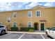 Exterior view of the building shows well-maintained landscaping and convenient parking at 2061 Crestdale Ln # 60, Lake Mary, FL 32746