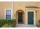 Inviting front door and well maintained landscaping enhance the curb appeal of this home at 2061 Crestdale Ln # 60, Lake Mary, FL 32746