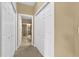 Hallway view towards a bathroom in neutral colors at 2061 Crestdale Ln # 60, Lake Mary, FL 32746
