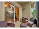 Relaxing outdoor patio with wicker furniture and sliding glass doors to the living area at 2061 Crestdale Ln # 60, Lake Mary, FL 32746