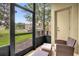 Screened porch with outdoor seating and view of the neighborhood at 2061 Crestdale Ln # 60, Lake Mary, FL 32746