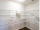 Spacious walk-in pantry with wire shelving for ample storage, ideal for organized kitchen convenience at 2835 San Marco Way, Winter Haven, FL 33884