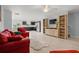 Open concept living area connecting the living room and kitchen in this modern home at 2850 Sanderling St, Haines City, FL 33844