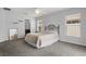Serene main bedroom featuring soft grey walls, plush carpeting, and natural light at 2850 Sanderling St, Haines City, FL 33844