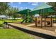 Playground with covered play structures, slides, and benches at 2850 Sanderling St, Haines City, FL 33844