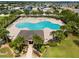 Aerial view of the community pool with palm trees and lounge chairs in a Gathering-friendly neighborhood at 2850 Sanderling St, Haines City, FL 33844