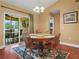 Bright dining area featuring a wooden table, chairs, and a sliding glass door to the patio at 2921 W Socrum Loop Rd, Lakeland, FL 33810