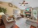 Bright living room features vaulted ceilings, brick fireplace, and elegant decor at 2921 W Socrum Loop Rd, Lakeland, FL 33810