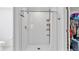 Bright bathroom with a white tiled shower and a view into the walk in closet at 2966 Flying Blackbird Rd, Bartow, FL 33830