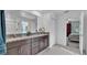 Bright bathroom featuring double sinks, granite countertops and modern finishes at 2966 Flying Blackbird Rd, Bartow, FL 33830