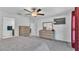 Comfortable carpeted bedroom with dresser, television and ceiling fan at 2966 Flying Blackbird Rd, Bartow, FL 33830