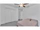 Neutral bedroom featuring double closets, ceiling fan and light gray carpet at 2966 Flying Blackbird Rd, Bartow, FL 33830