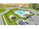 Aerial view of the community pool, playground, parking, and construction sites at 2966 Flying Blackbird Rd, Bartow, FL 33830