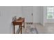Inviting entryway with neutral decor, featuring a table and window with natural light at 2966 Flying Blackbird Rd, Bartow, FL 33830