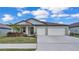 Charming single-story home with a three-car garage and well-manicured lawn at 2966 Flying Blackbird Rd, Bartow, FL 33830