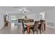 Bright living room area with sliding doors to the outside, adjacent to the dining area at 2966 Flying Blackbird Rd, Bartow, FL 33830