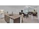 Open living space features kitchen island, dining table, and comfortable living room furniture at 2966 Flying Blackbird Rd, Bartow, FL 33830
