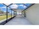 The screened patio offers a relaxing outdoor space with views of the backyard at 2966 Flying Blackbird Rd, Bartow, FL 33830