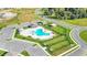 Aerial shot showcases the community pool featuring ample parking and seating at 2966 Flying Blackbird Rd, Bartow, FL 33830