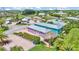 An aerial view of the property, showing its landscaping, hardscaping, and proximity to other homes at 3052 Wood Duck Dr, Polk City, FL 33868