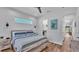 Comfortable bedroom with wood-look floors, serene decor, and a walk-in closet at 3052 Wood Duck Dr, Polk City, FL 33868