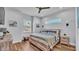 Serene bedroom featuring neutral tones, wood accents, and natural light from two windows at 3052 Wood Duck Dr, Polk City, FL 33868