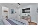 Light, airy bedroom with walk-in closet, wood floors, and serene decor at 3052 Wood Duck Dr, Polk City, FL 33868