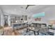 Open-concept living room with a kitchen island, modern appliances, and comfortable seating area at 3052 Wood Duck Dr, Polk City, FL 33868