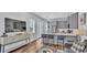 Modern living room with large television, stylish decor, and an adjacent open-concept kitchen at 3052 Wood Duck Dr, Polk City, FL 33868