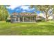 Enjoy the screened-in porch and lush green lawn at 3107 Stonewater Dr, Lakeland, FL 33803