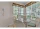 Cozy breakfast nook with large windows and wicker chairs at 3107 Stonewater Dr, Lakeland, FL 33803