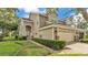 Charming two-story home featuring a well-manicured lawn and a two-car garage at 3107 Stonewater Dr, Lakeland, FL 33803