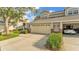 Charming townhome showing a two-car garage and lush landscaping at 3107 Stonewater Dr, Lakeland, FL 33803