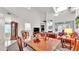 Bright living room features vaulted ceiling, fireplace, and dining area at 3107 Stonewater Dr, Lakeland, FL 33803