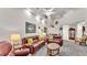 Spacious living room featuring high ceilings, recessed lighting, and comfortable leather seating at 3107 Stonewater Dr, Lakeland, FL 33803