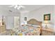 Bright main bedroom with floral comforter and ensuite bathroom at 3107 Stonewater Dr, Lakeland, FL 33803