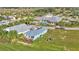 High angle shot of home near a community pool, a clubhouse and manicured lawns at 3270 Green Heron Dr, Polk City, FL 33868
