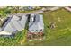 Aerial view of charming home near a lush green golf course at 3270 Green Heron Dr, Polk City, FL 33868