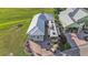 Birds eye view of a charming home with an RV and golf cart parked on a lush green lawn at 3270 Green Heron Dr, Polk City, FL 33868