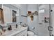 Modern bathroom with a stylish vanity, a large mirror, and a glass-enclosed shower at 3270 Green Heron Dr, Polk City, FL 33868