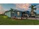Charming home with a neatly landscaped yard, RV parking, and a golf cart at 3270 Green Heron Dr, Polk City, FL 33868