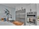 Modern kitchen with stainless steel refrigerator and oven, quartz countertops, and a sleek black faucet at 3270 Green Heron Dr, Polk City, FL 33868