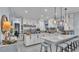Modern kitchen featuring an island with barstool seating, stainless steel appliances, and pendant lighting at 3270 Green Heron Dr, Polk City, FL 33868