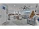Spacious living room and kitchen with modern appliances, white cabinets, and an open concept at 3270 Green Heron Dr, Polk City, FL 33868